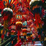 Colorful lanterns create a festive atmosphere in a Bangkok mall.