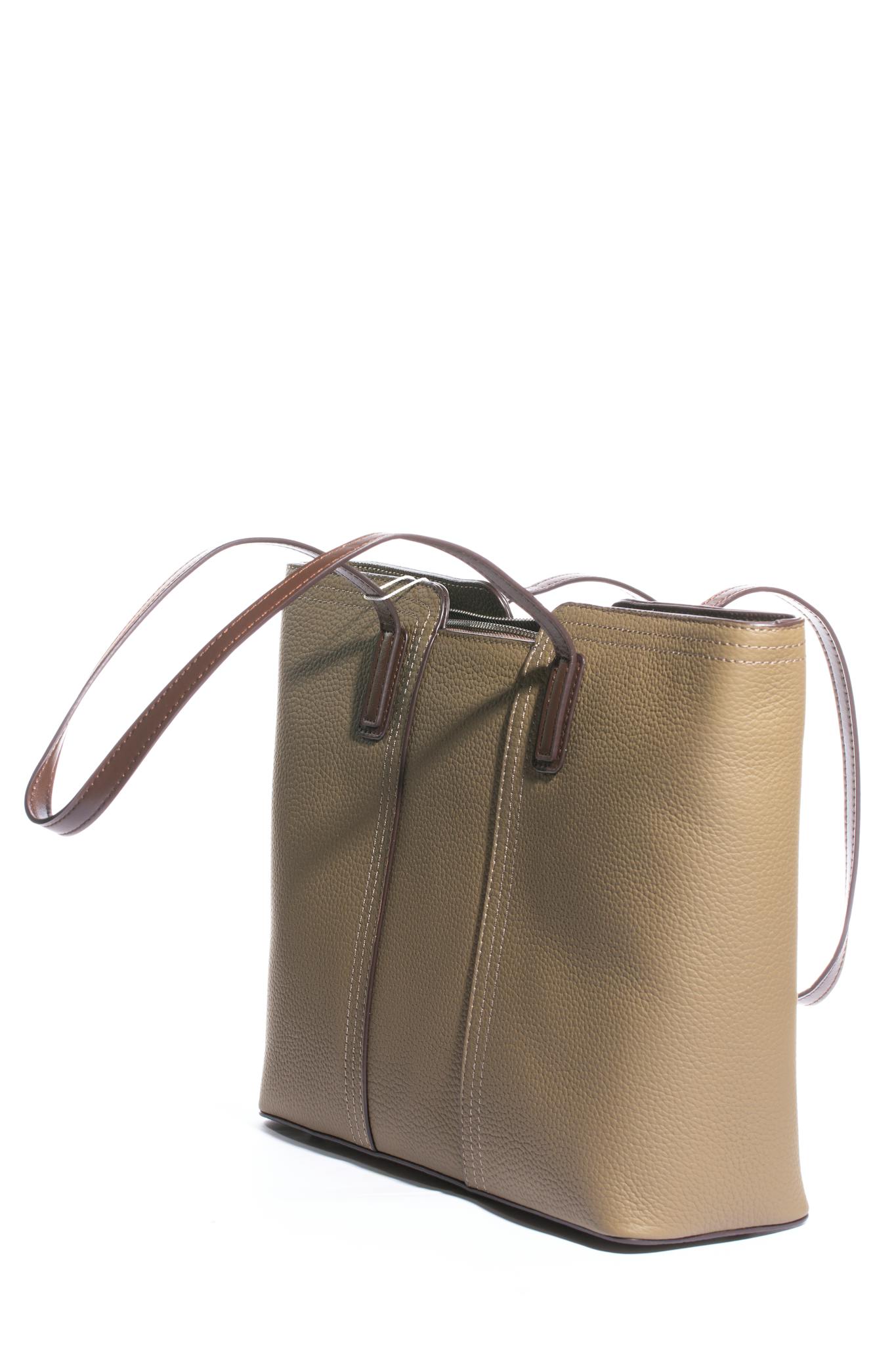 Sophisticated brown leather handbag featuring long straps, perfect for fashion-forward individuals.