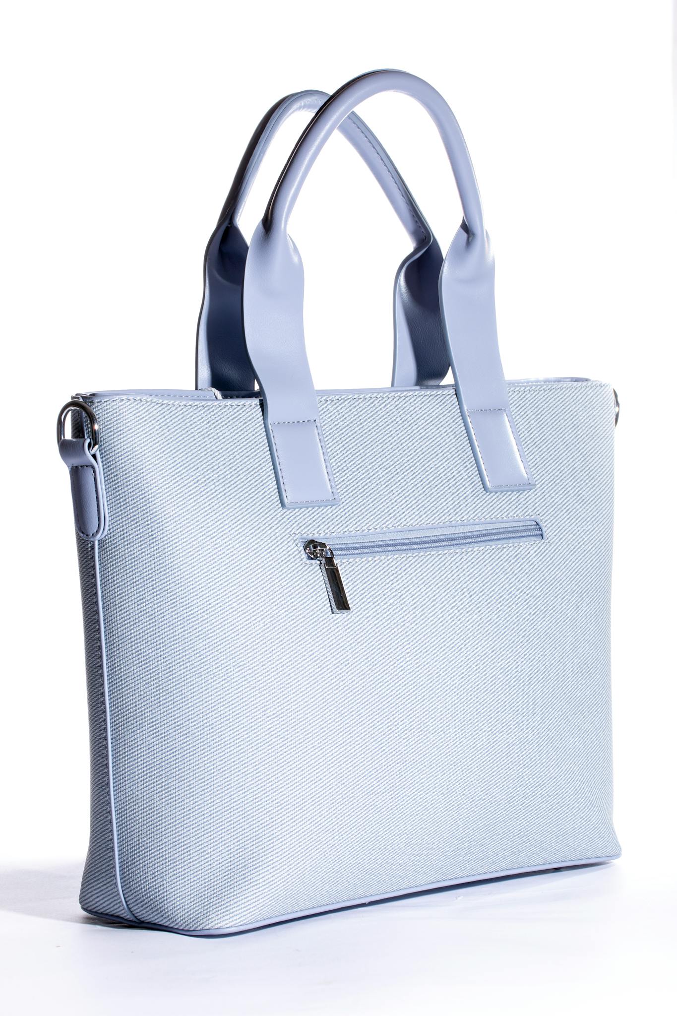 Stylish light blue leather handbag with handles on a white background, perfect for fashion and retail.